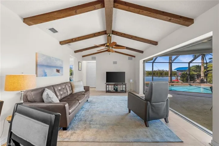Living Room with Pocket Sliders to Pool and Water Views