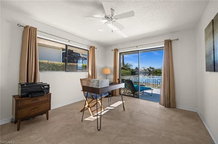 Guest Bedroom 1 with Water Views andPrivate Patio Access