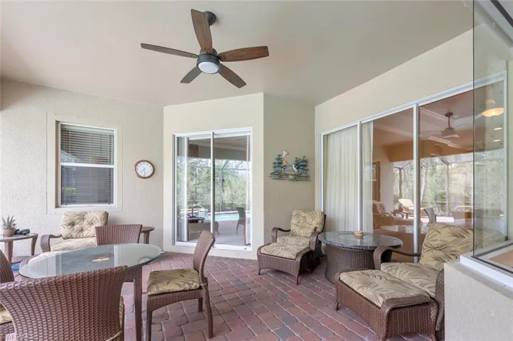 View of patio featuring a ceiling fan and outdoor dining area