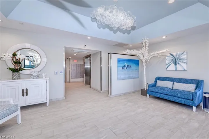 NEW LOBBY with recessed lighting, a chandelier, and elevator