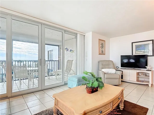 Living room featuring light tile patterned floors