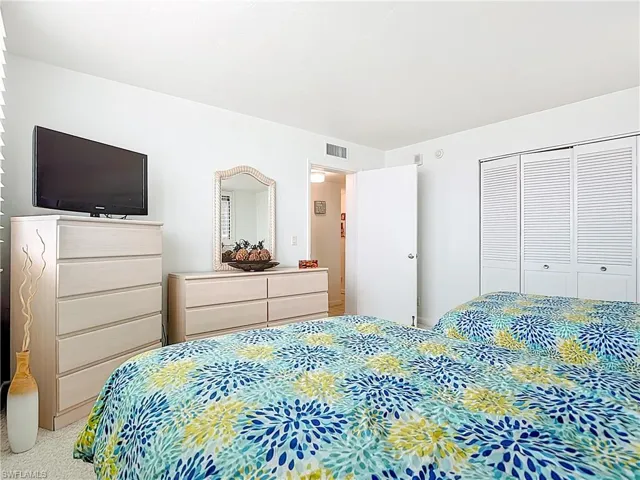 Bedroom featuring a closet and carpet