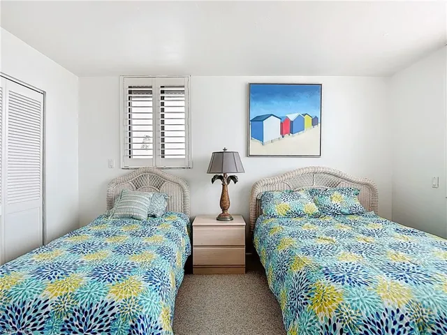 Bedroom with carpet flooring and a closet