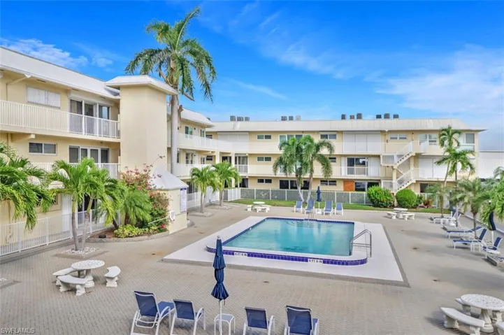 Community pool featuring a patio