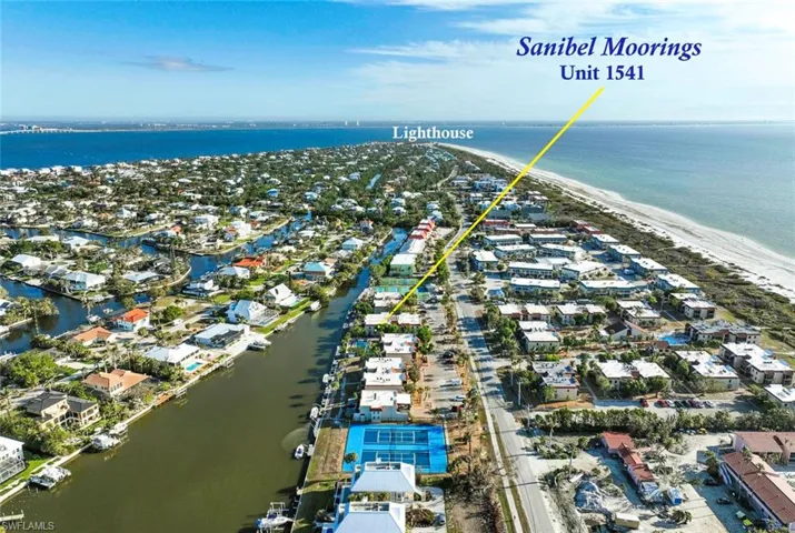 Aerial view featuring a canal view and a short walk to the beach