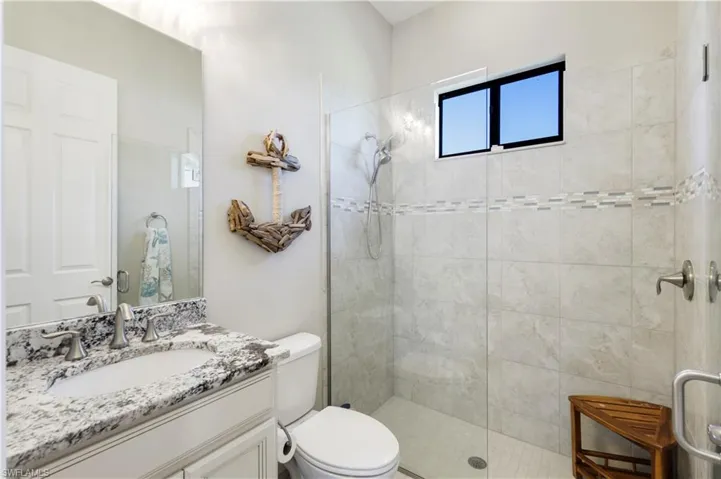 Full bath featuring vanity and a walk in shower