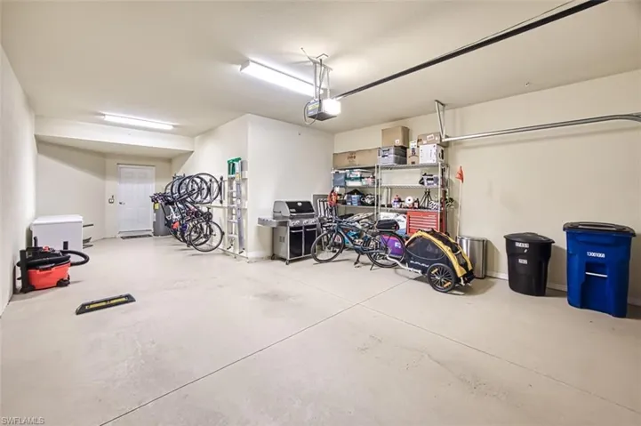 Garage featuring a garage door opener