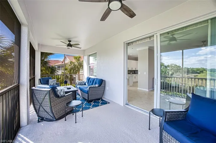 Sunroom featuring ceiling fan
