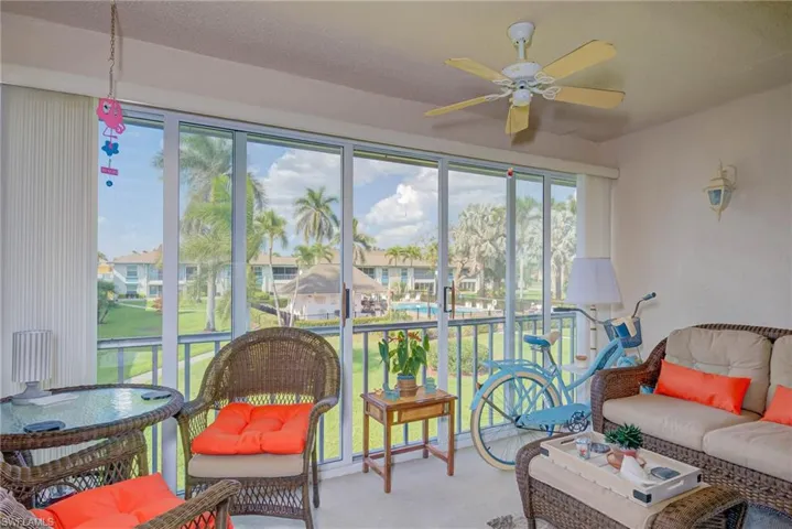 Sunroom featuring carpet floors
