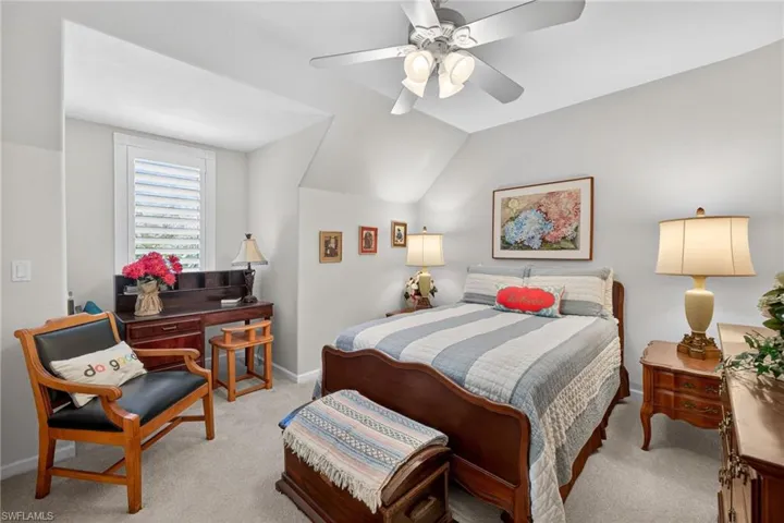 2nd level 3rd Guest Bedroom featuring light colored carpet, ceiling fan, and lofted ceiling