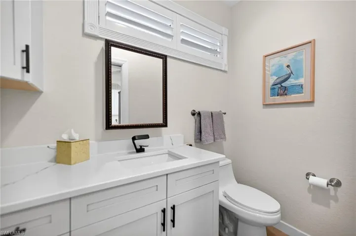 Half Bathroom off the Kitchen in Utility/ Laundry Area
