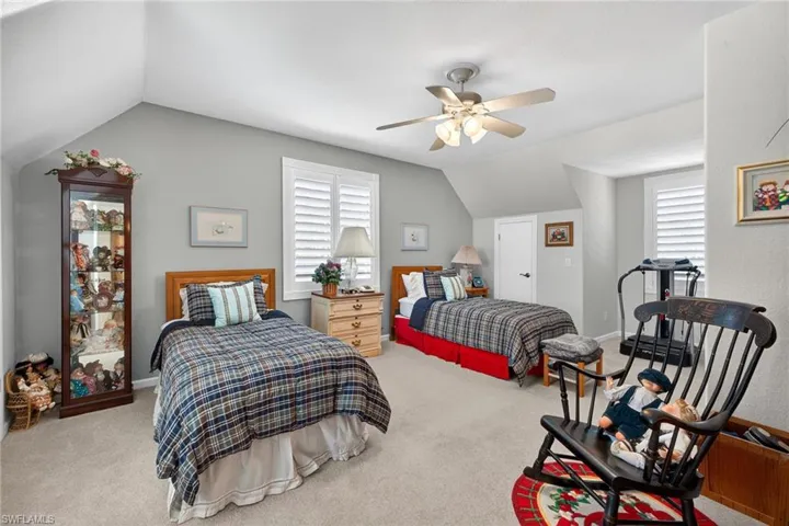 2nd level 4th Guest Bedroom with vaulted ceiling, light colored carpet, and a ceiling fan