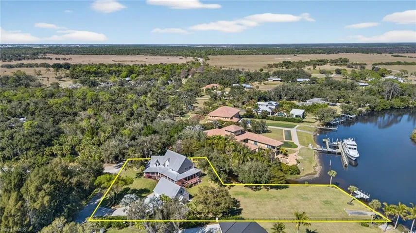 Aerial perspective of suburban area with property boundaries highlighted and riverview