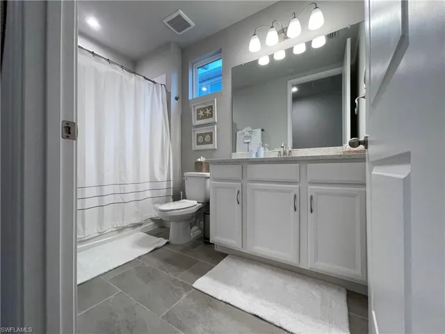 Bathroom with vanity and toilet