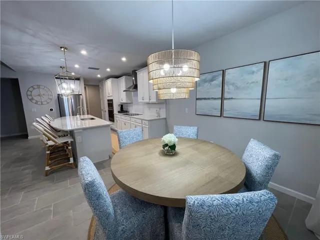 Dining room featuring a chandelier and recessed lighting