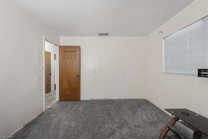Unfurnished room with carpet floors