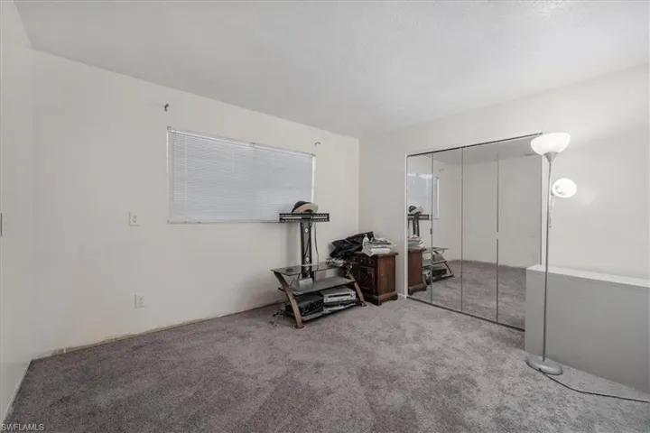 Bedroom with a closet and carpet floors