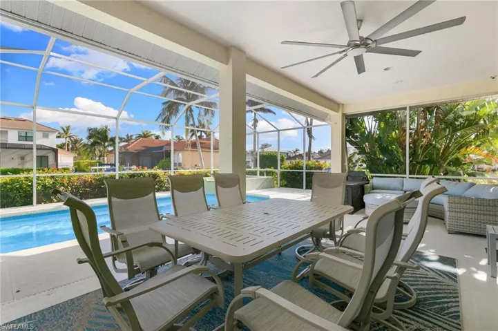 outdoor living space, ceiling fan, and a lanai
