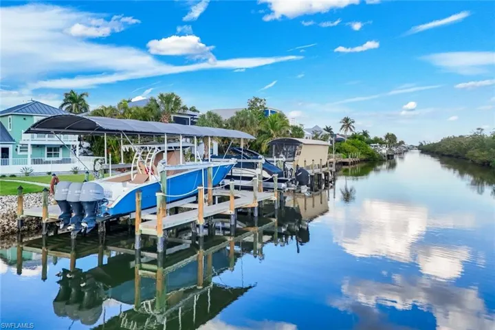 Dock with boat lift and a water view