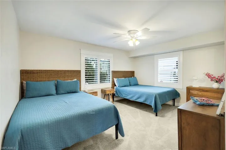 Bedroom featuring carpet and a ceiling fan