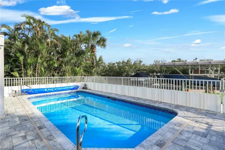 View of swimming pool with patio surround