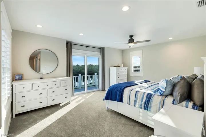 Bedroom featuring light colored carpet, access to outside, recessed lighting, and ceiling fan