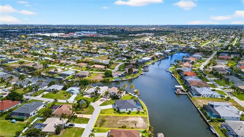 Aerial perspective of suburban area with a nearby body of water