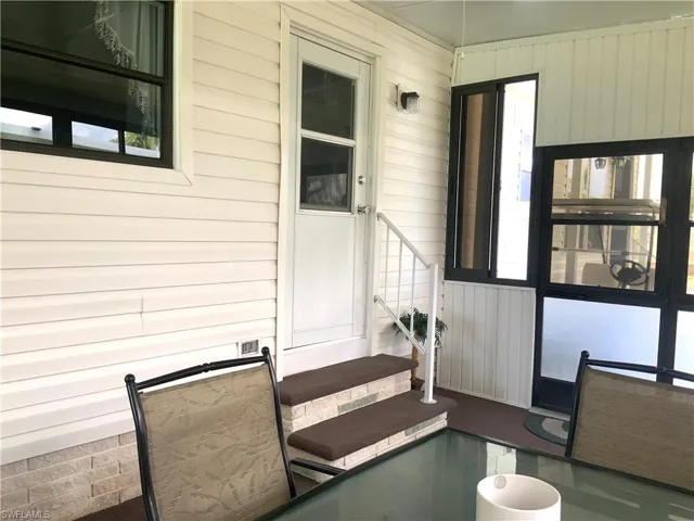 Screened lanai dining area with Kitchen access.