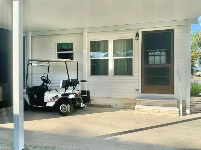 Front entry under long covered drive for 2 cars