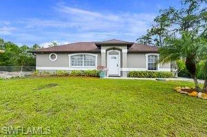 Single story home with stucco siding