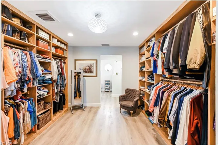 Spacious closet featuring wood finished floors