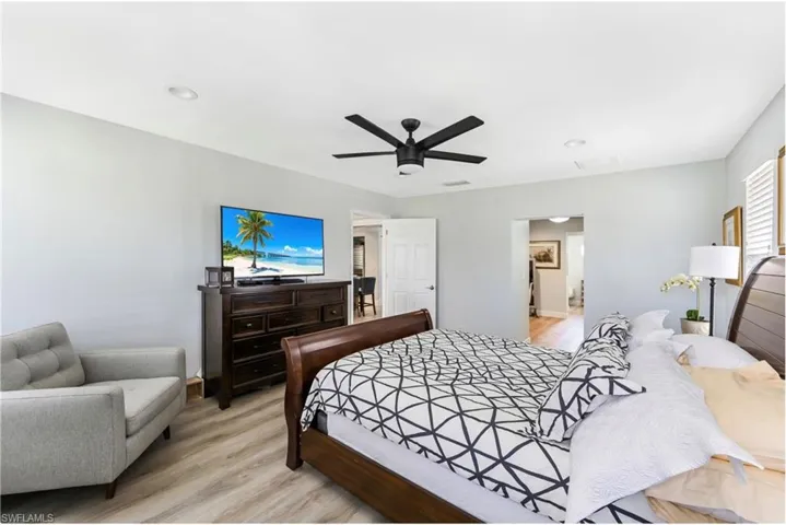 Bedroom featuring light wood-type flooring and ceiling fan