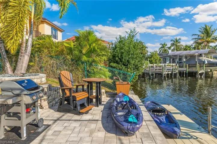 Dock featuring a water view and a fire pit