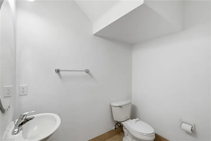 Bathroom featuring a sink and toilet
