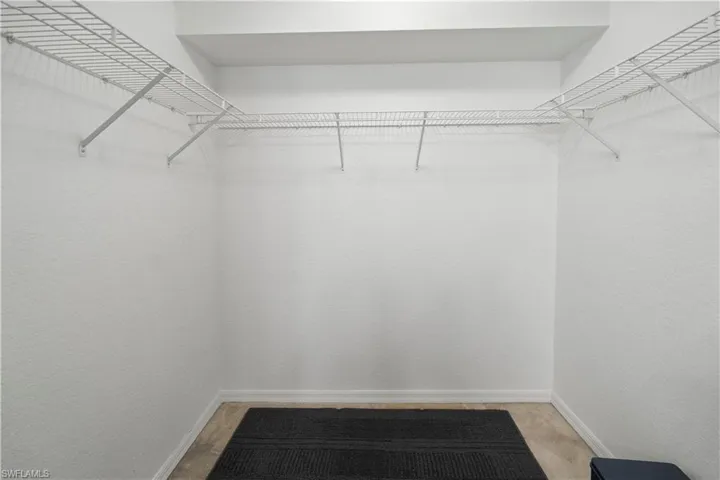 Spacious closet featuring carpet floors