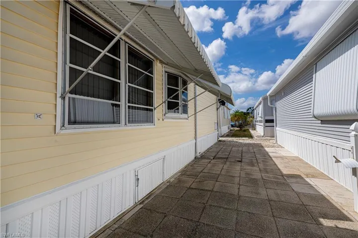 View of property exterior featuring a patio area