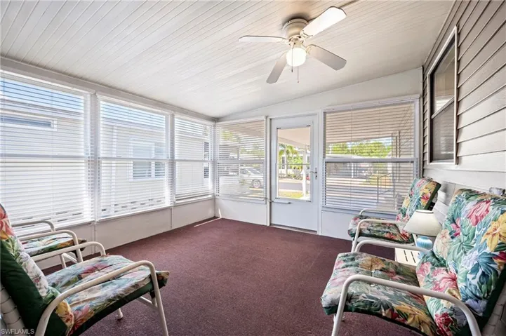 Sunroom / solarium with a ceiling fan