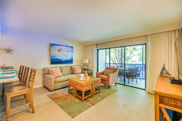 Living area featuring light wood-type flooring and baseboards