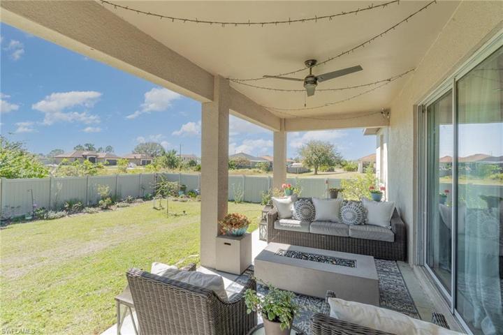 covered patio and backyard
