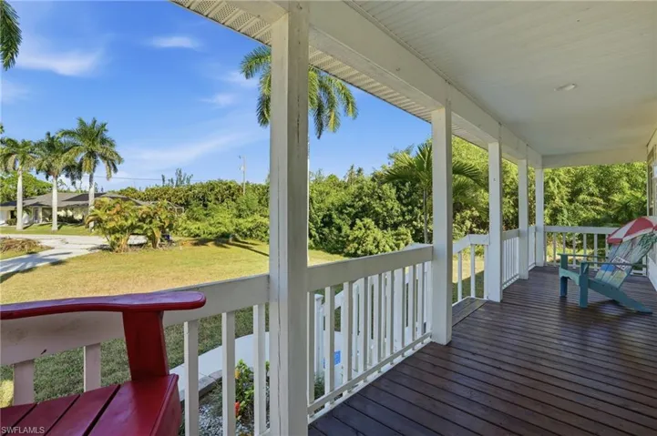 Relax on the front porch overlooking your sprawling property