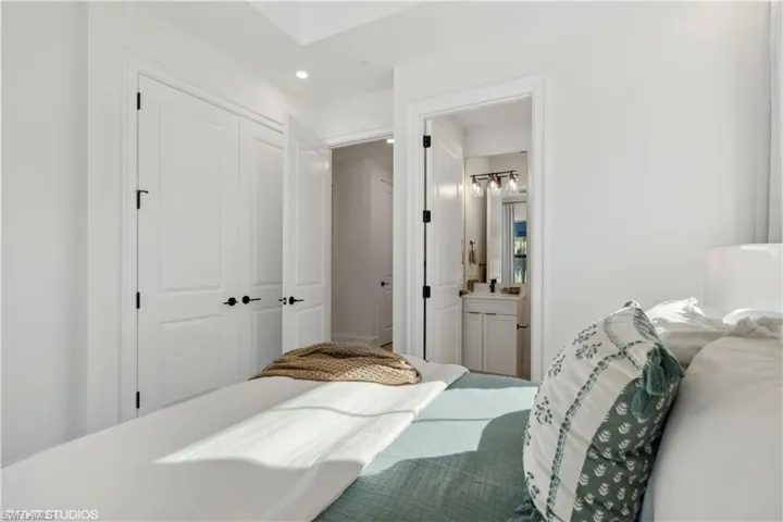Bedroom featuring ensuite bath and a closet