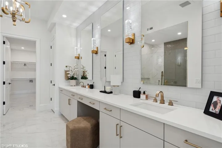 Bathroom with vanity and an enclosed shower