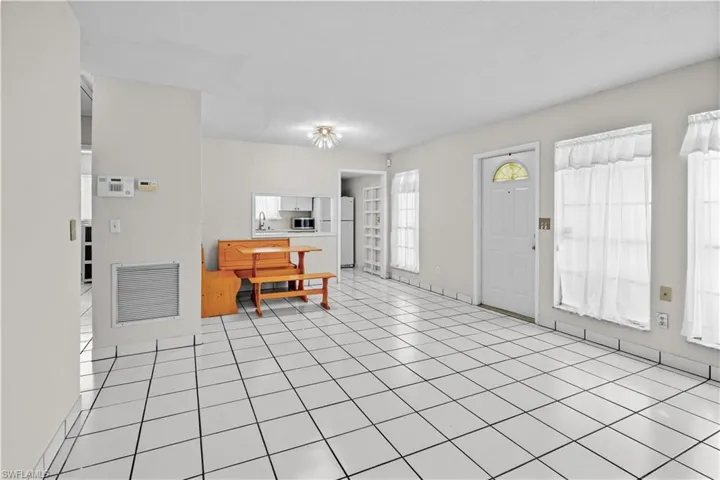 Living Room - Front door, dining area, pass-thru to the kitchen