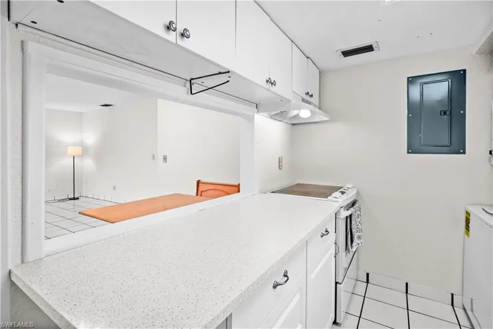 Kitchen - Pass-thru to dining, stove/oven, ample cabinets