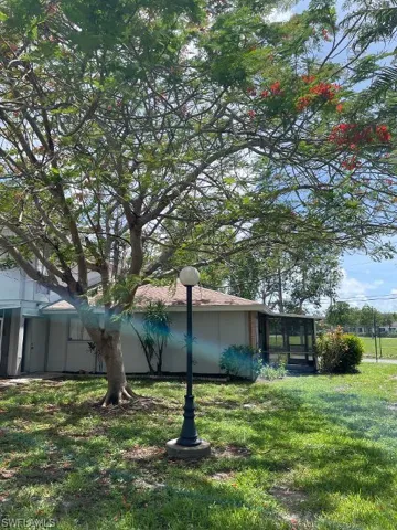 EAST SIDE OF UNIT #1 - BEAUTIFUL ROYAL POINCIANA TREE
