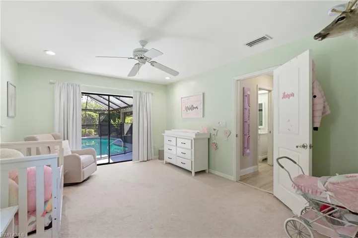 Bedroom featuring a sunroom, light colored carpet, a ceiling fan, access to exterior, and recessed lighting