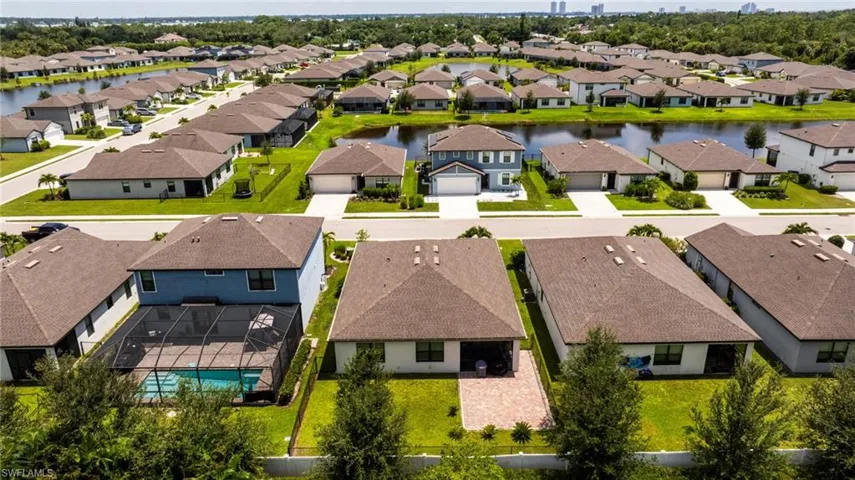 Aerial view of residential area with a nearby body of water
