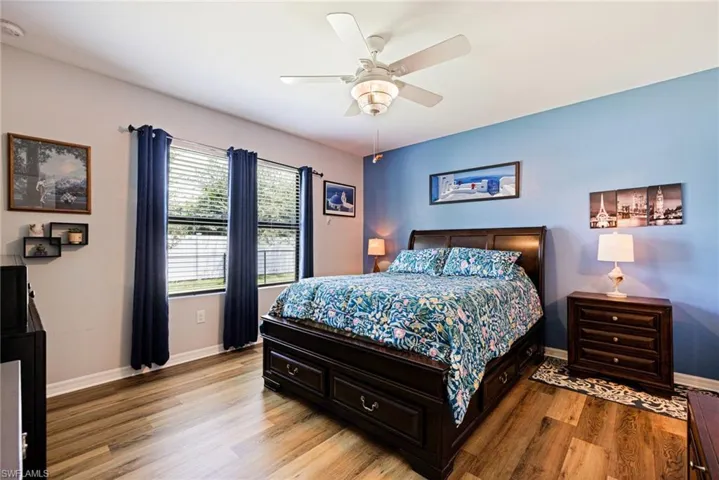 Bedroom featuring light wood-type flooring and ceiling fan