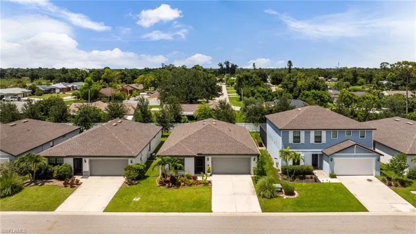 Aerial view of residential area with a tree filled landscape