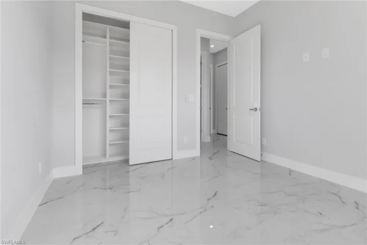 Unfurnished bedroom featuring a closet